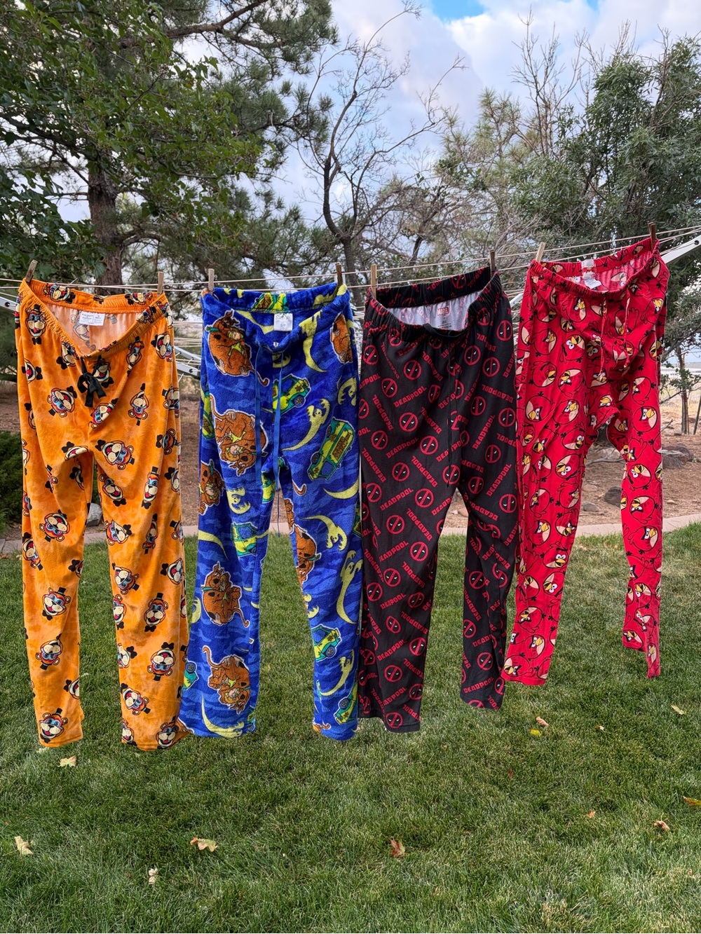 Plush Character Pajama Pants - Red, Black, Blue, Orange.
